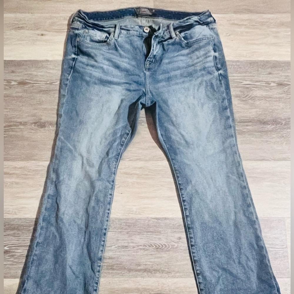 Torrid MidRise Slim Boot cut Jean in light wash blue.